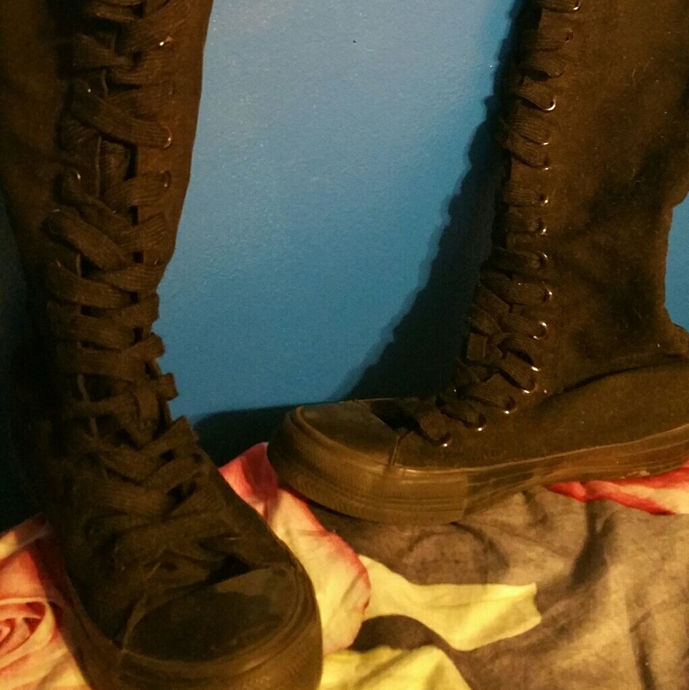 Knee high laced sneaker boots